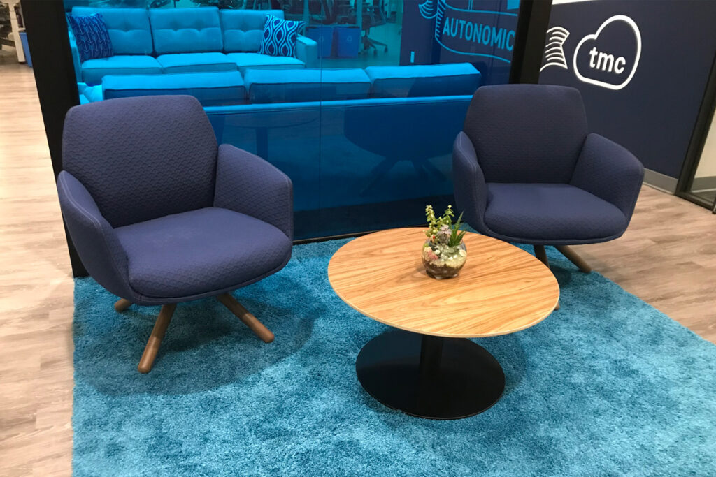 Two arm chairs behind a small circle table