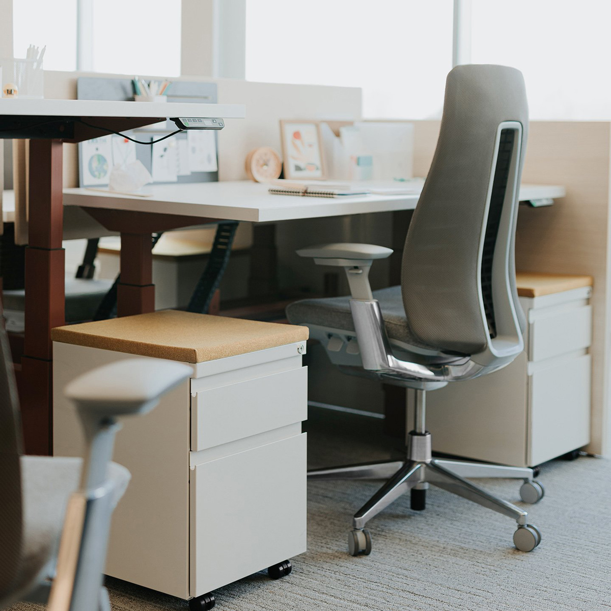 Office chair at a desk with two small filing cabinets